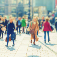 street of blurred busy people